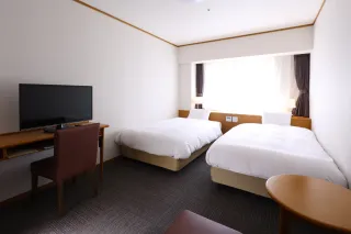 ゆとりのある空間でゆったり寛げるツインベッドの客室